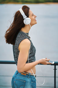 Midsection of woman using mobile phone