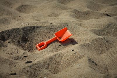 High angle view of red sand on beach
