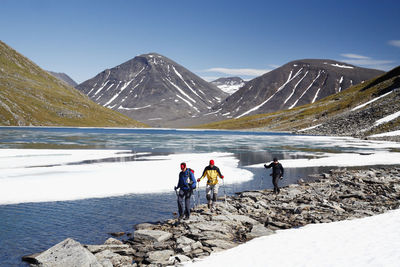 Hikers at lake  on the move