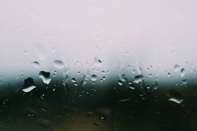 Close-up of water drops on glass