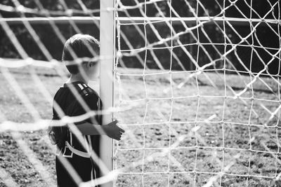 Boy playing on soccer field