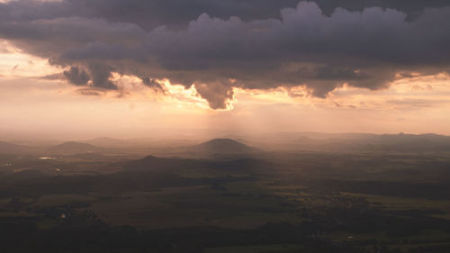 Aerial view of landscape against dramatic sky