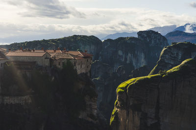 Panoramic view of buildings and mountains against sky