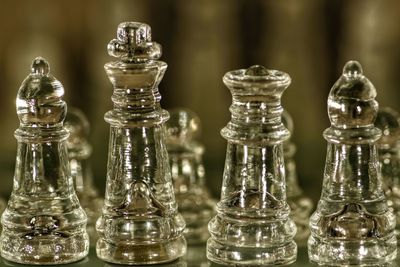 Close-up of chess pieces on table