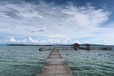 Pier over sea against sky