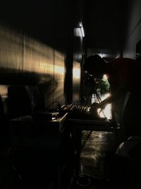 Side view of man working in subway