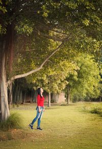 Full length of boy standing in park