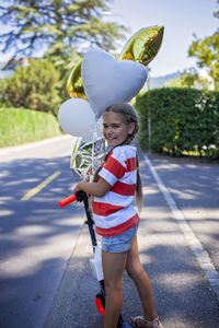 Low section of woman holding umbrella