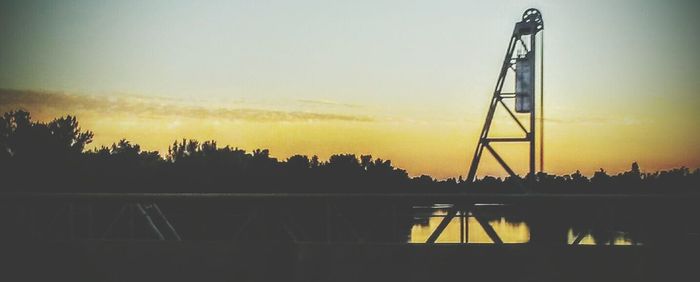 Electricity pylon at sunset