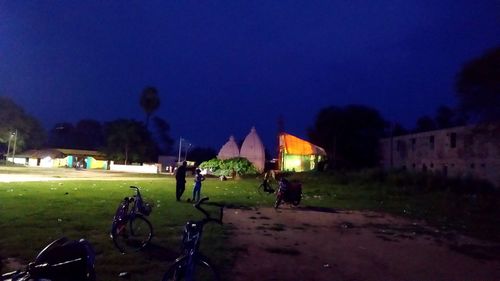 People on field in park at night