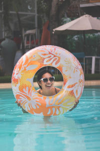 Portrait of woman swimming in pool