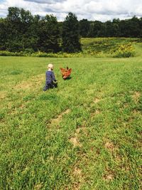 People walking on grassy field