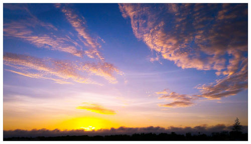 Scenic view of dramatic sky during sunset