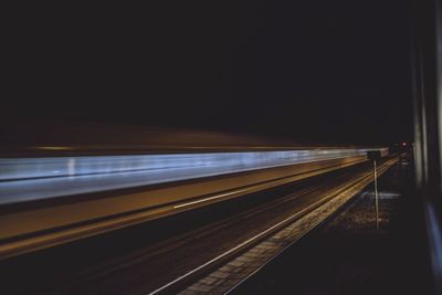 Light trails on train at night