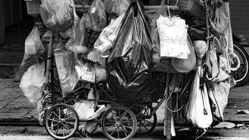 Bicycles hanging on street in city