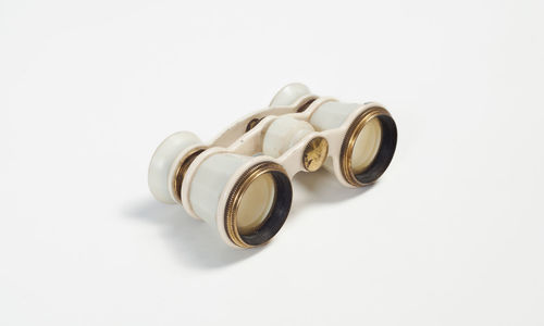 Close-up of camera over white background