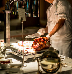 Close-up of man preparing food