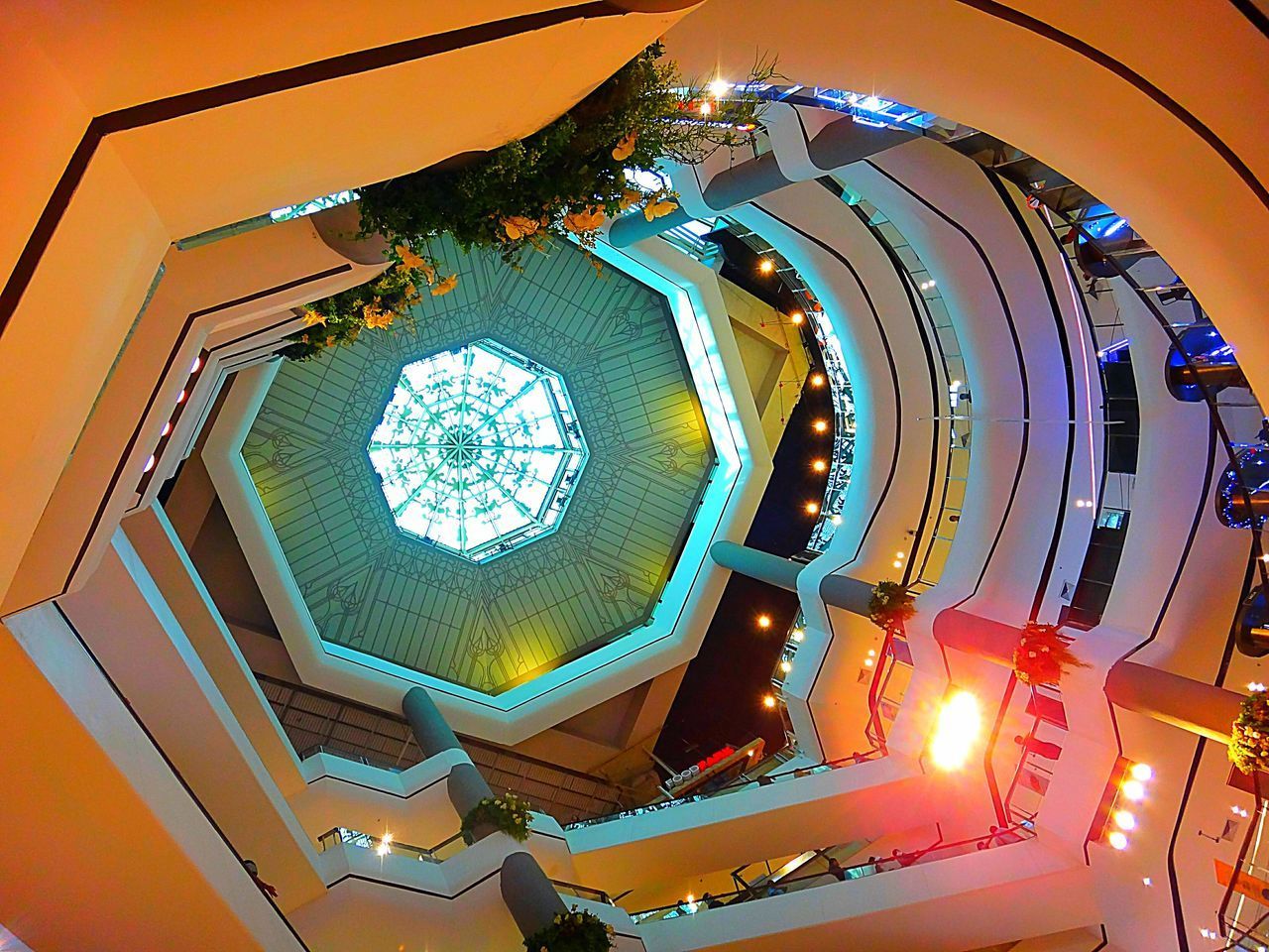 LOW ANGLE VIEW OF ILLUMINATED LIGHT HANGING FROM CEILING