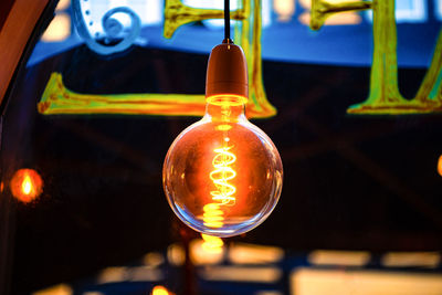 Close-up of illuminated light bulb