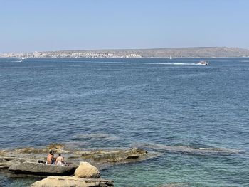 Scenic view of sea against clear sky