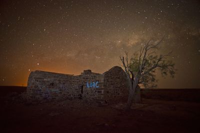 Built structure against sky at night