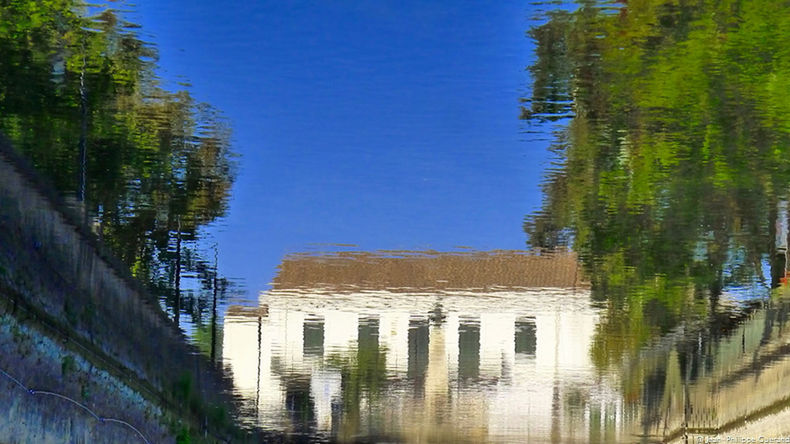 REFLECTION OF BUILDINGS ON WATER