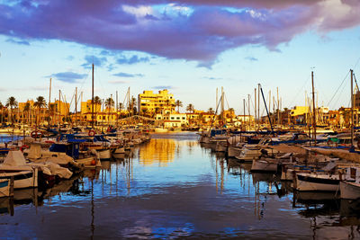 Boats moored at harbor