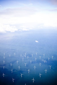 Aerial view of wind turbines in sea