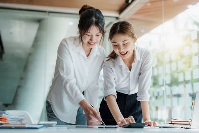 Business colleagues working in office