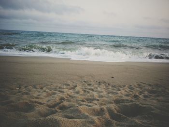 Scenic view of beach against sky