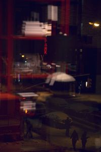 Illuminated city street at night