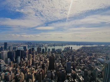 High angle view of city against cloudy sky