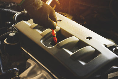 Close-up of man working on machine