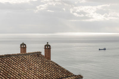 Panoramic view of a sea view from the gulf of salerno and a ship crossing it to mean a concept