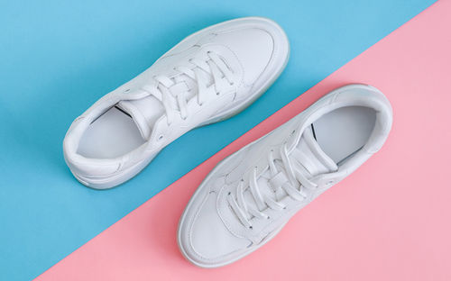 High angle view of shoes on colored background