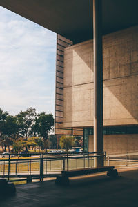 Road by building against sky