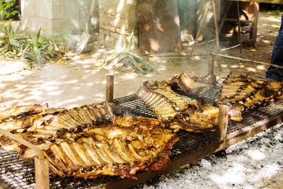 High angle view of fish on barbecue grill