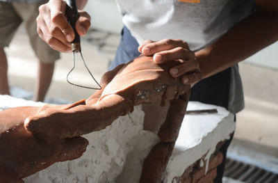 Close-up of man holding equipment