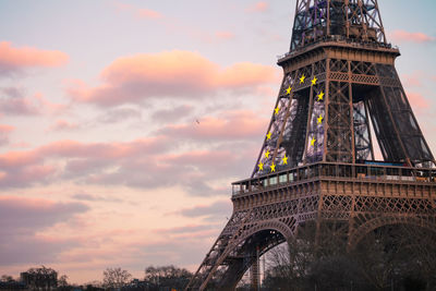 Low angle view of eiffel tower against sky during sunset