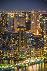 Illuminated buildings in city at night