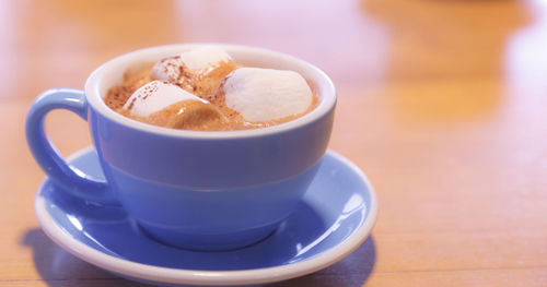 Close-up of coffee cup on table