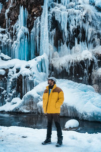 Full length of man standing on snow