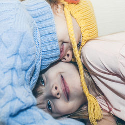 Portrait of girl lying on bed