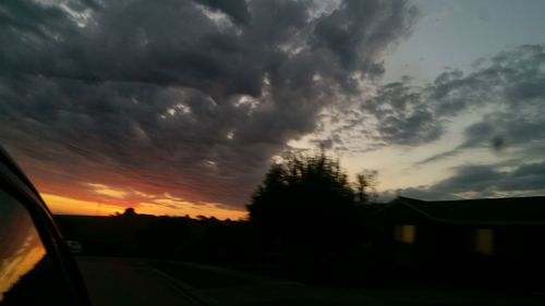 Close-up of road against dramatic sky