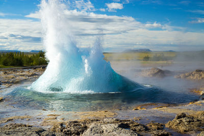 Hot spring at yellowstone national park against sky