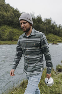 Young man standing on land