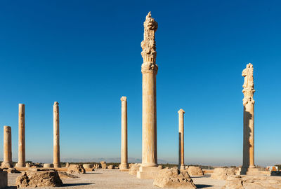 View of old ruins of persepolis against clear sky.