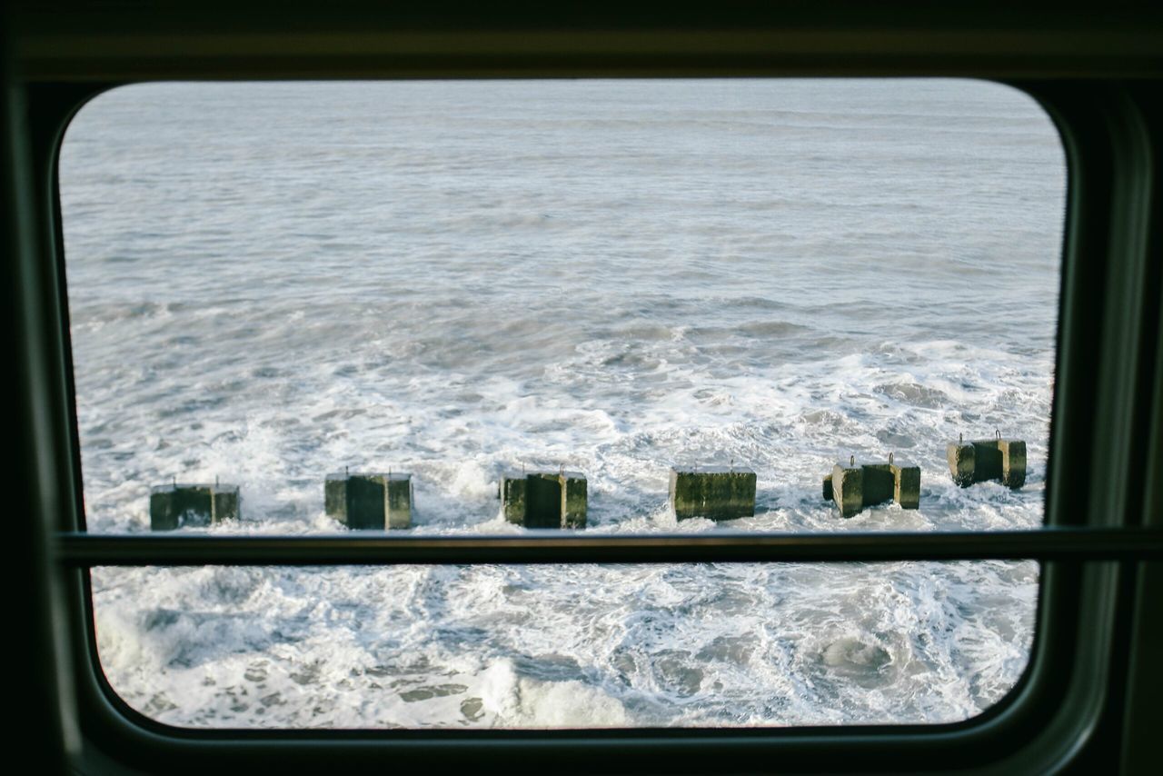 SEA SEEN THROUGH WINDOW