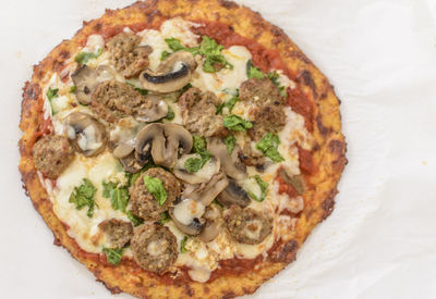 High angle view of pizza served on table