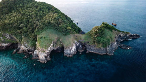 High angle view of rocks on beach against sky